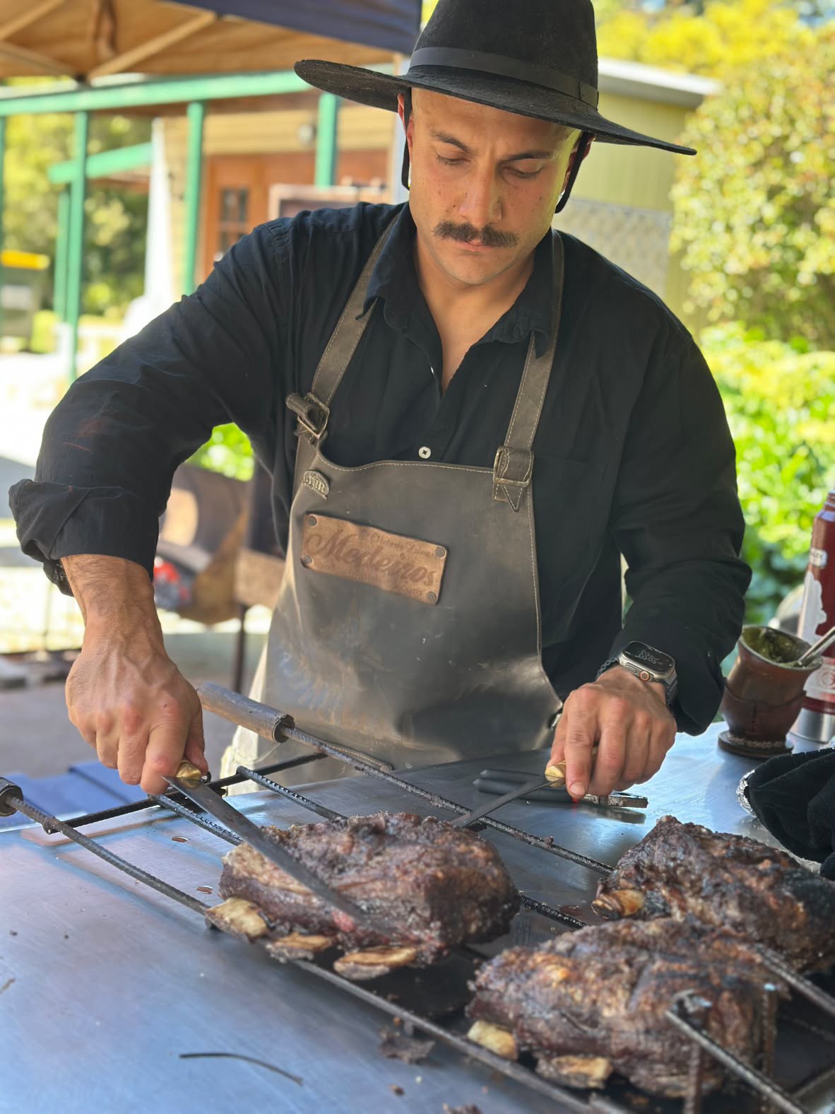 Fresh barbecue being carved at a Bagual gathering