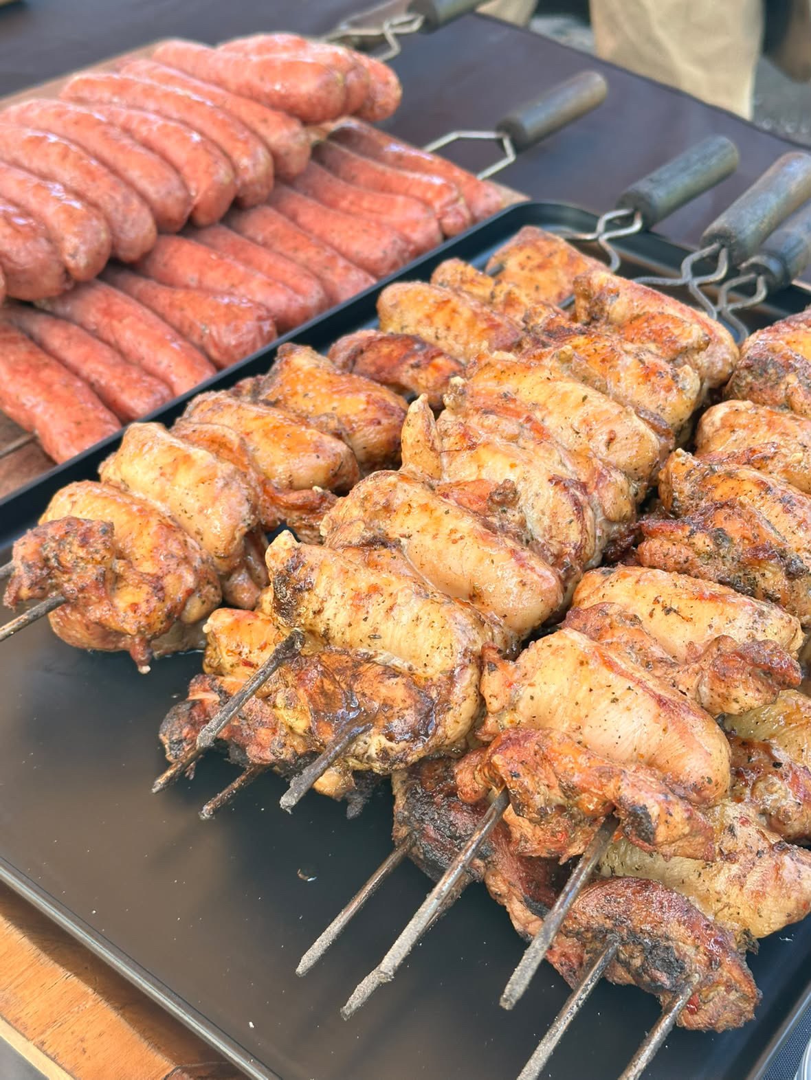 A full grill of barbecue skewers